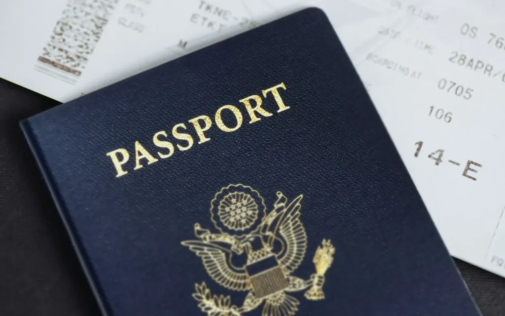 Passport lying on top of a boarding pass